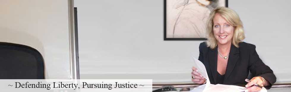 Attorney Pamela Lindmark at her desk: Defending Liberty, Pursuing Justice