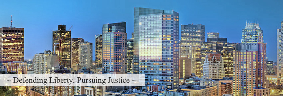 Boston skyline at dusk: Defending Liberty, Pursuing Justice